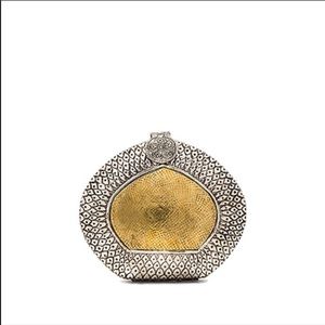 From St Xavier Amber Clutch in Gold & Silver